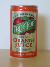 orange juice can with apples on label